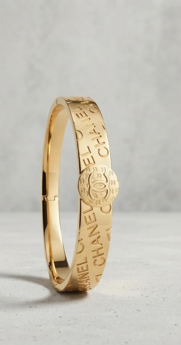 Gold-Tone Embossed Lettering and Interlocking Logo Bangle Bracelet